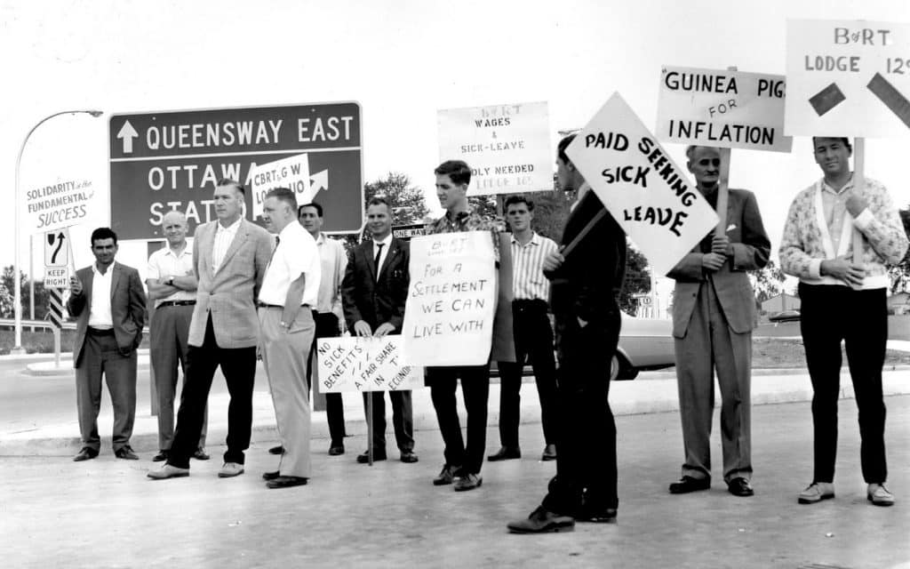 Members of the Brotherhood of Railroad Trainmen, one of the SMART Transportation Division's predecessor unions, picket for paid sick time in the mid 20th-century.