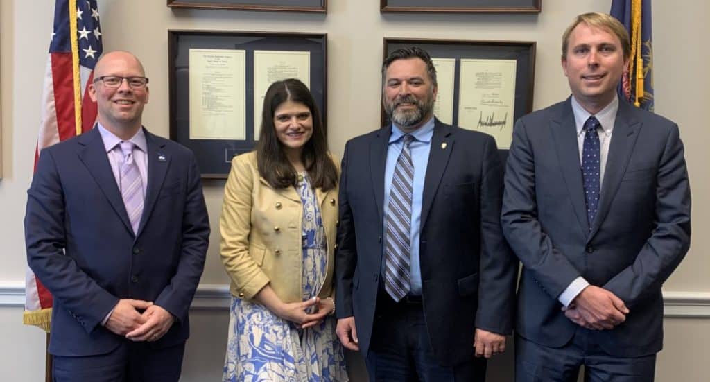 Michigan State Legislative Director Don Roach (left) meets U.S. Rep. Haley Stevens on May 17. At right of Stevens are Scott Hoose and Owen Smith.