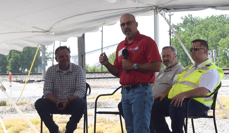 SMART Transportation Division President Jeremy Ferguson addresses the audience as Norfolk Southern CEO Alan Shaw, left, looks on during the June 1 event at NS's Bellevue Yard.