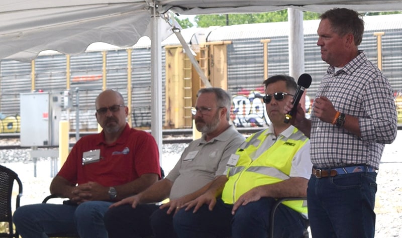 With SMART Transportation Division President Jeremy Ferguson listening at left, Norfolk Southern CEO Alan Shaw addresses the audience at the Bellevue Yard in Ohio on June 1.