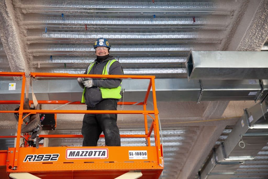 A SMART sheet metal worker on a lift.